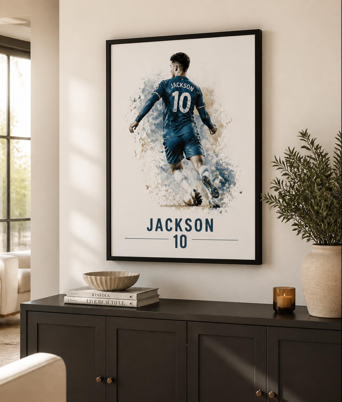 Framed personalised footballer print above a charcoal sideboard